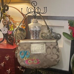 Coach Poppy Brown Signature C Wristlet